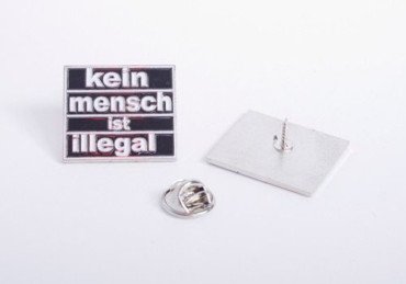 Metalpin "Kein Mensch ist illegal"